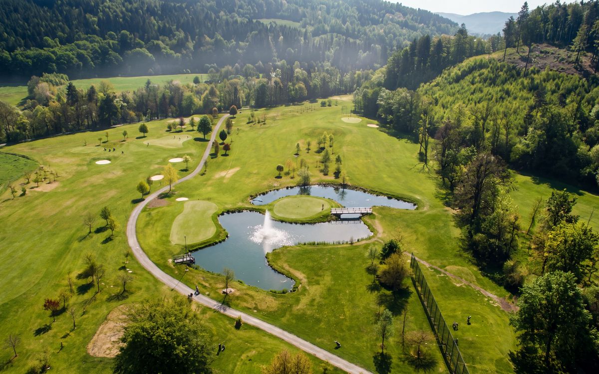 Golf course in Rožnov pod Radhoštěm surrounded by the Beskid Mountains